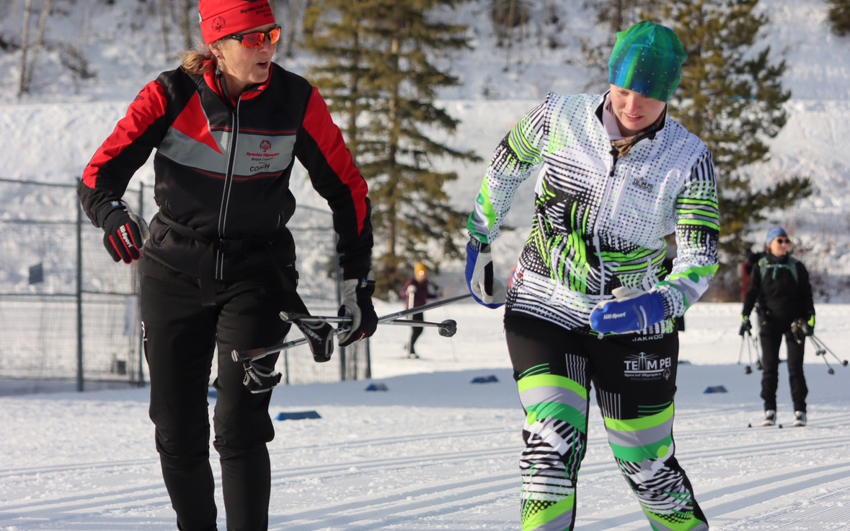 Special Olympics Team Canada Cross Country Skiing Head Coach, Annabelle Stanley (BC), training alongside athlete Ellen MacNearney (PEI)..